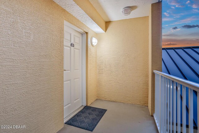 3721 S Atlantic Ave Unit 207, Daytona Beach Shores, FL 32118 - entrance to property featuring a balcony and stucco siding