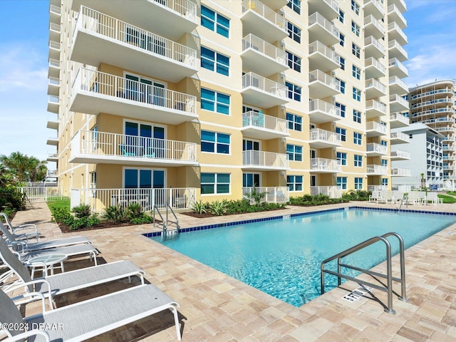 3721 S Atlantic Ave Unit 207, Daytona Beach Shores, FL 32118 - community pool featuring a patio area