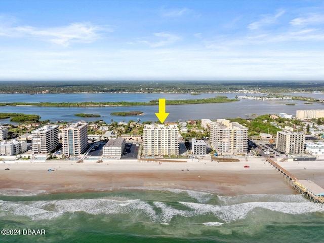 aerial view featuring a view of the beach and a water view