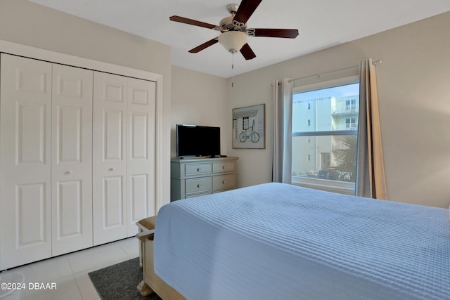 3721 S Atlantic Ave Unit 207, Daytona Beach Shores, FL 32118 - bedroom featuring a closet, a ceiling fan, and light tile patterned floors