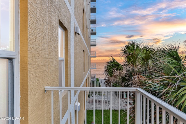 balcony at dusk with a water view