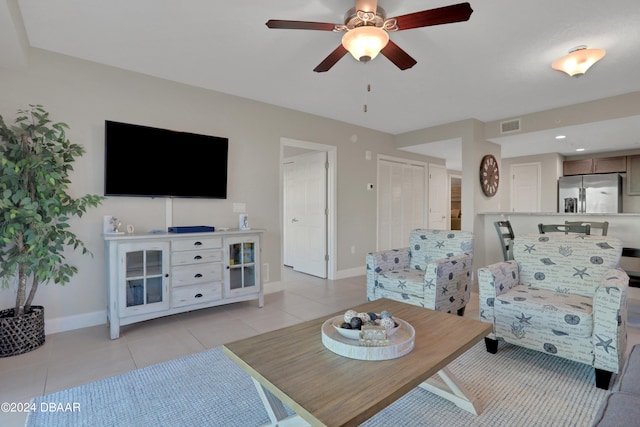 tiled living room featuring ceiling fan