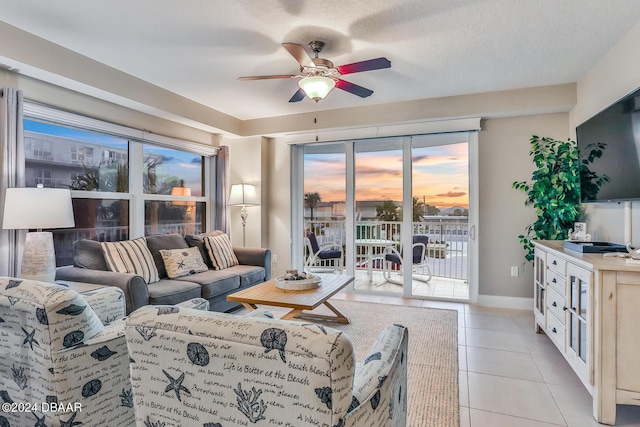 3721 S Atlantic Ave Unit 207, Daytona Beach Shores, FL 32118 - living room with a ceiling fan and light tile patterned floors