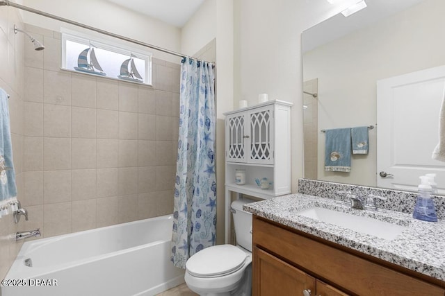 full bathroom featuring toilet, vanity, and shower / bathtub combination with curtain