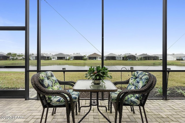 sunroom with a water view