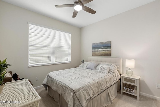 bedroom with light carpet and ceiling fan