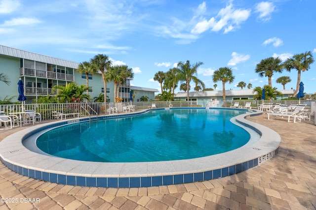 view of swimming pool featuring a patio area