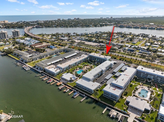 birds eye view of property featuring a water view