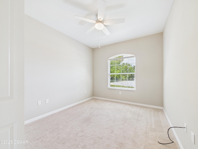 63 Park Place Cir, Palm Coast, FL 32164 - spare room featuring carpet flooring, a ceiling fan, and baseboards