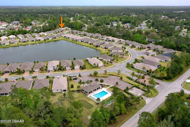 drone / aerial view with a residential view and a water view