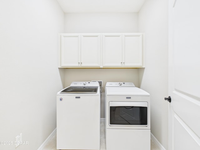 63 Park Place Cir, Palm Coast, FL 32164 - washroom featuring washer and dryer, cabinet space, and baseboards
