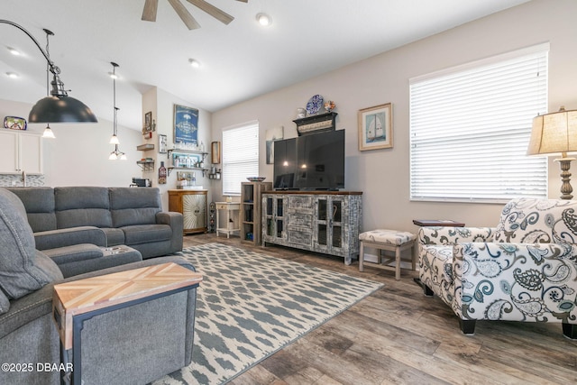 living room with vaulted ceiling, wood finished floors, and a ceiling fan