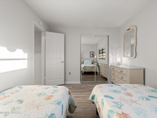 bedroom featuring a closet and light wood-type flooring