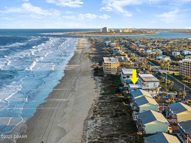 aerial view featuring a view of the beach and a water view