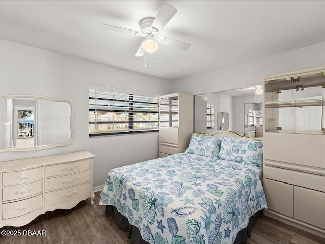 bedroom with dark wood-type flooring and ceiling fan