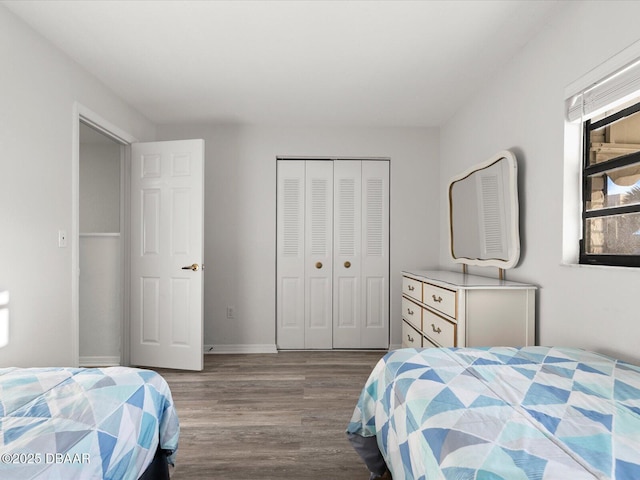 bedroom featuring light hardwood / wood-style floors and a closet