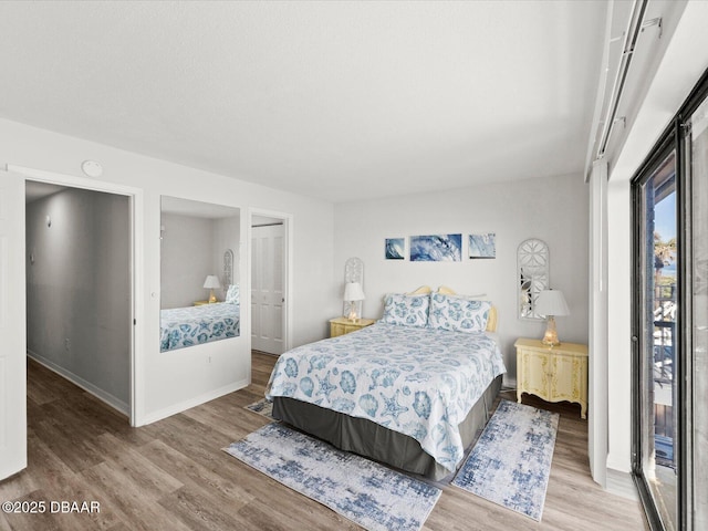 bedroom with wood-type flooring