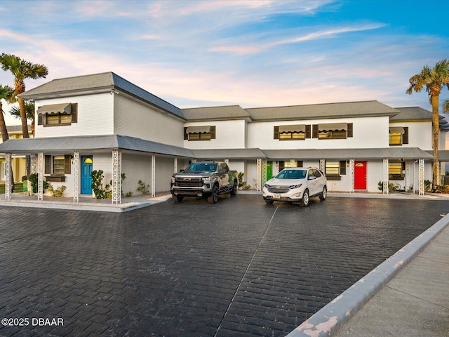 view of outdoor building at dusk