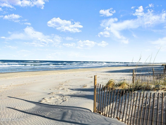 view of water feature with a beach view