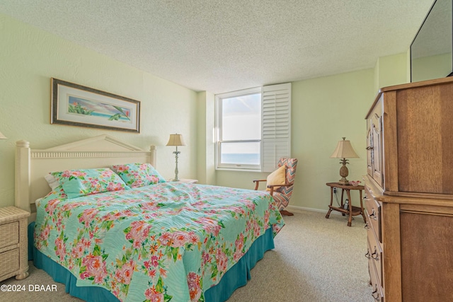 carpeted bedroom with a textured ceiling