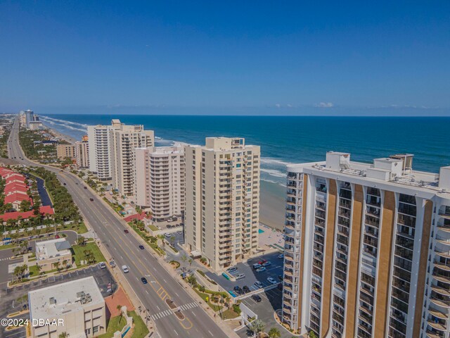 drone / aerial view featuring a view of the beach and a water view