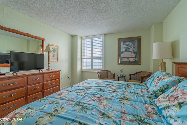 bedroom featuring a textured ceiling