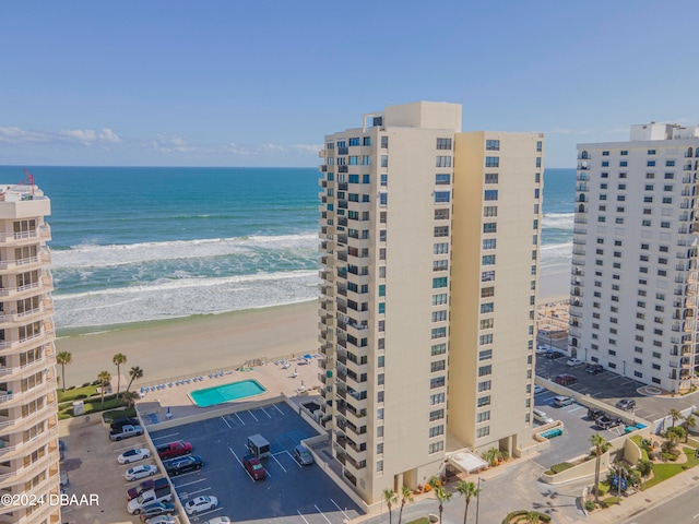 birds eye view of property featuring a view of the beach and a water view