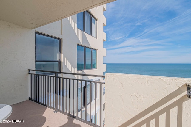 balcony featuring a water view