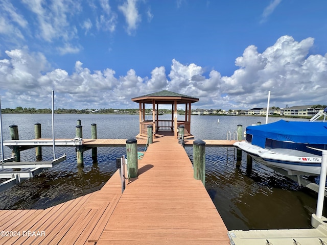 dock area with a gazebo and a water view