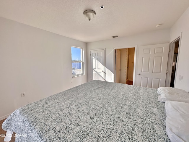 bedroom with a textured ceiling