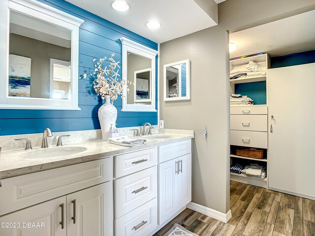 bathroom featuring wood-type flooring and vanity