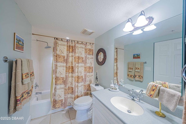 bathroom with visible vents, toilet, a textured ceiling, vanity, and tile patterned floors