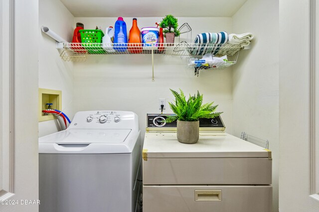 laundry room featuring separate washer and dryer