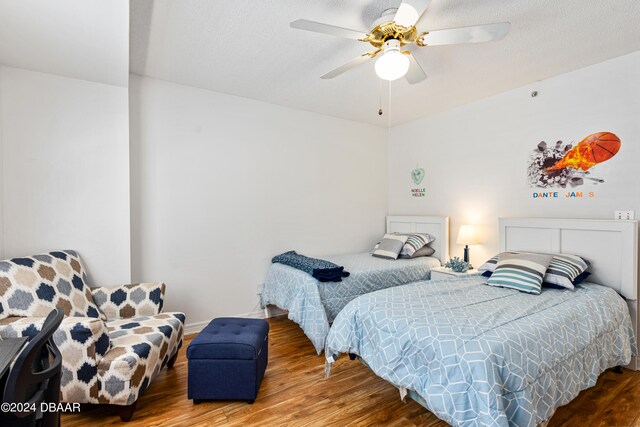 bedroom featuring wood-type flooring and ceiling fan