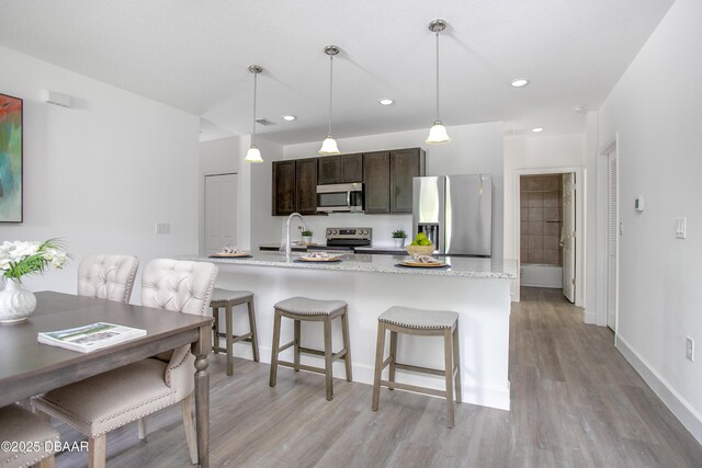 empty room with dark hardwood / wood-style floors and plenty of natural light