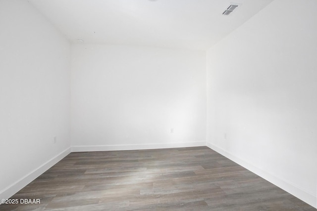 empty room with dark hardwood / wood-style floors