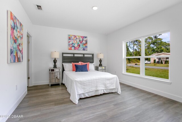 walk in closet with dark hardwood / wood-style flooring