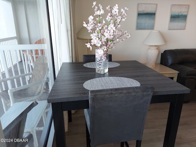 dining area featuring wood-type flooring