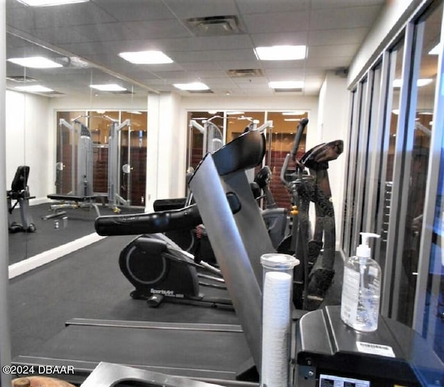 gym featuring a drop ceiling