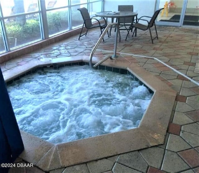 view of swimming pool featuring an indoor in ground hot tub