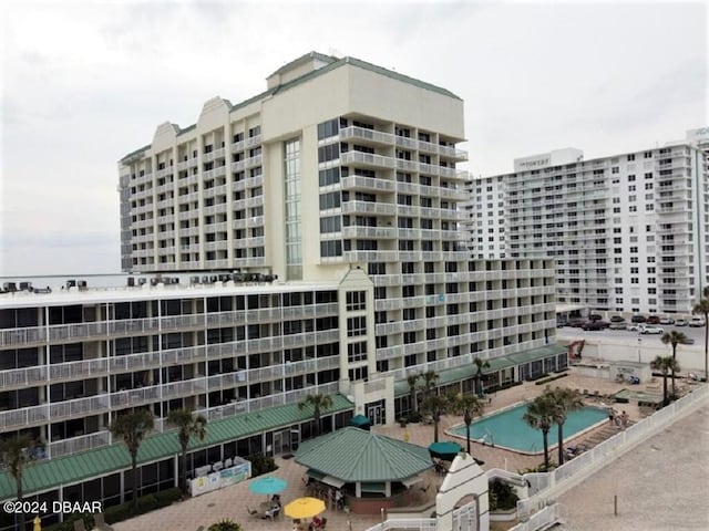 view of property featuring a community pool