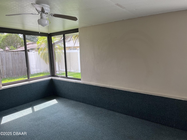 913 New Castle Ct, Holly Hill, FL 32117 - unfurnished sunroom featuring plenty of natural light and carpet flooring