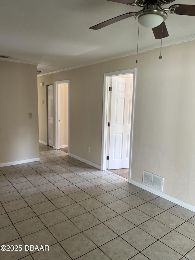 913 New Castle Ct, Holly Hill, FL 32117 - spare room featuring a ceiling fan, crown molding, and light tile patterned floors