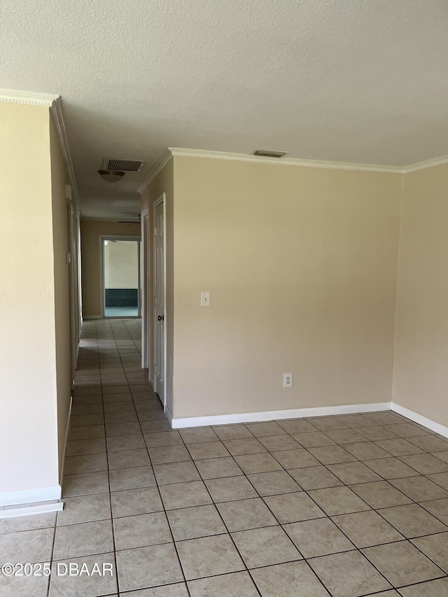 913 New Castle Ct, Holly Hill, FL 32117 - unfurnished room featuring crown molding, light tile patterned flooring, and a textured ceiling