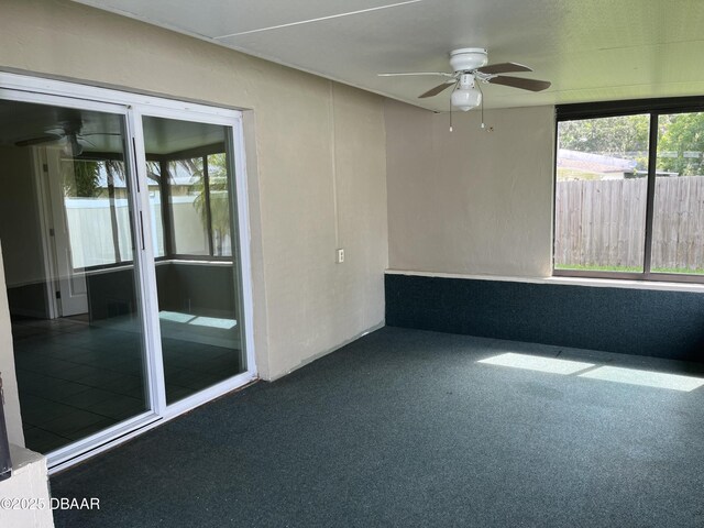 913 New Castle Ct, Holly Hill, FL 32117 - unfurnished sunroom with a ceiling fan and plenty of natural light