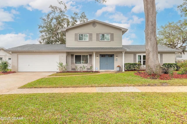 traditional-style house featuring driveway, brick siding, a front lawn, and an attached garage