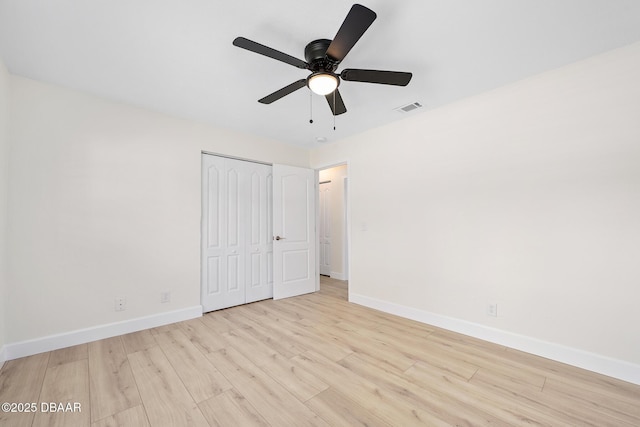 1972 Red Cedar Cir S, Daytona, FL 32119 - unfurnished bedroom with wood finished floors, baseboards, a closet, and ceiling fan