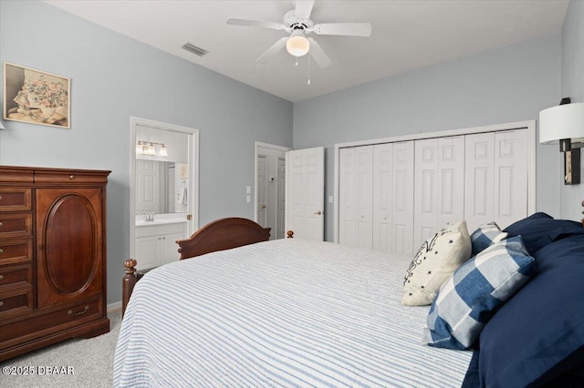 3356 Newbliss Cir, Ormond Beach, FL 32174 - bedroom with visible vents, connected bathroom, light colored carpet, a closet, and a ceiling fan