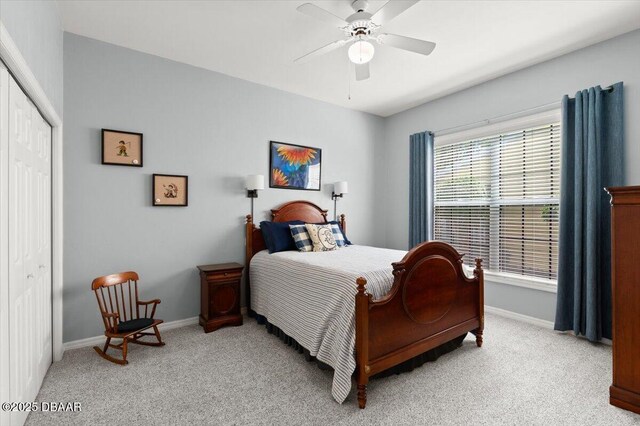 3356 Newbliss Cir, Ormond Beach, FL 32174 - bedroom featuring light carpet, ceiling fan, a closet, and baseboards