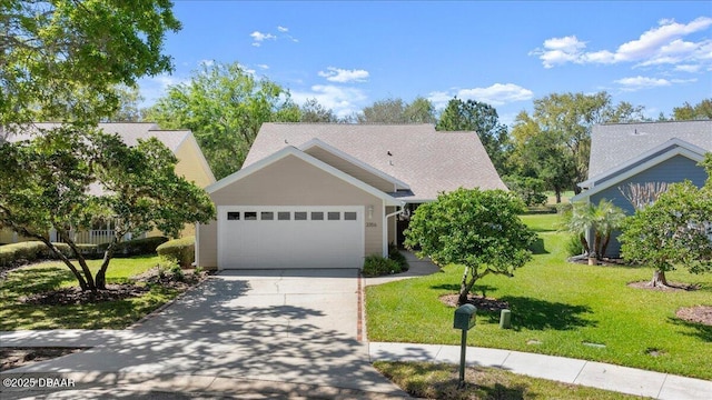 3356 Newbliss Cir, Ormond Beach, FL 32174 - view of front of property featuring an attached garage, concrete driveway, and a front lawn